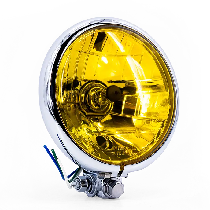 Phare rond Vintage Bates FCR, optique jaune, cuvelage aluminium brossé/chromé, vue trois-quarts avant gauche.