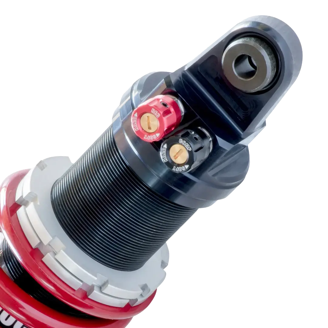 Vue de détail des réglages de l’amortisseur Shock Factory M-Shock 2 rouge pour Triumph Rocket 3, molettes séparées de compression et de détente.