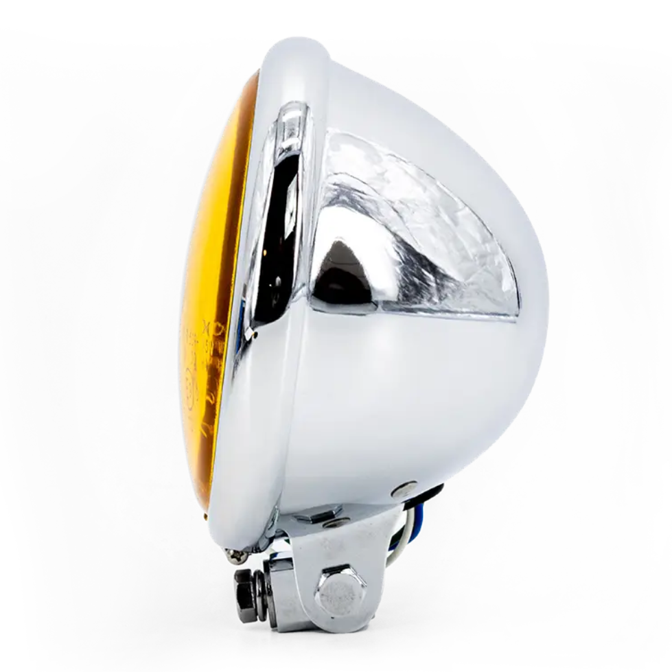 Phare rond Triumph Vintage Bates, optique jaune, corps argent poli, vue latérale droite montrant la profondeur du bol.