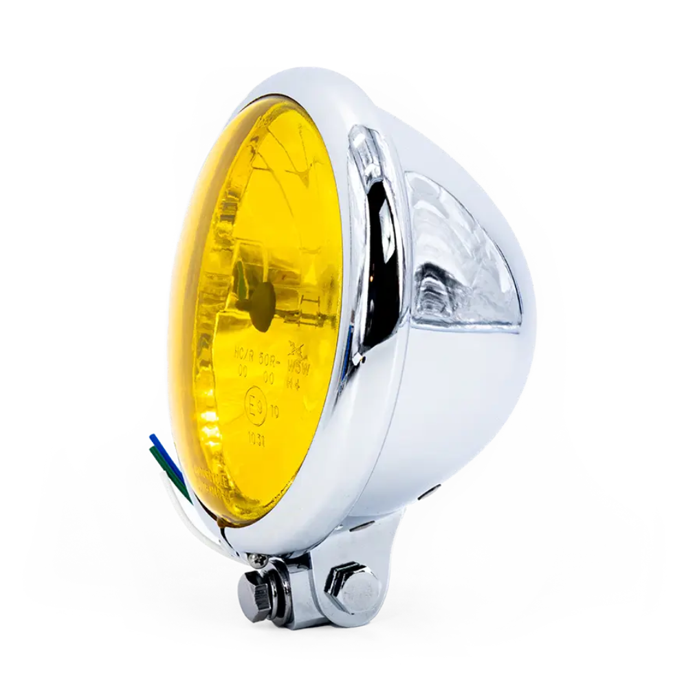 Phare rond Vintage Bates, optique jaune, finition argent, vue trois-quarts avant droite monté sur support.